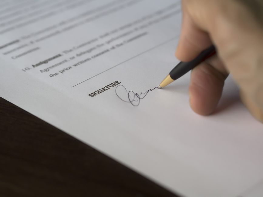 Signing paperwork close up - Unlimited mileage car hire in South Africa